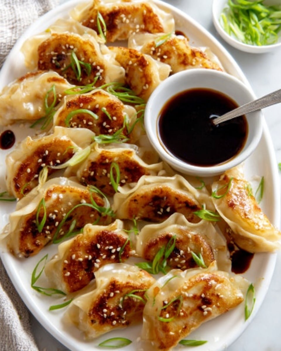 A large white rectangular serving platter filled with an entire batch of golden-brown pan-fried dumplings arranged neatly in rows, each dumpling garnished with finely sliced green onions and sprinkled sesame seeds, accompanied by a small white bowl of dark soy dipping sauce with a spoon resting inside, all presented on a white marble countertop with natural lighting highlighting the crispy texture and vibrant garnishes, professional food styling, photo taken with an iphone --ar 4:5 --v 7