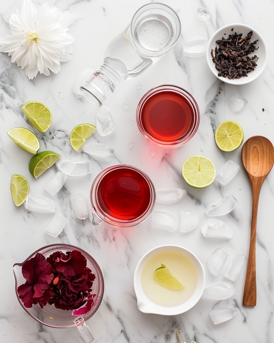 Single clear glass mason jar containing a vibrant red hibiscus iced tea filled with ice cubes, a fresh lime wedge perched on the rim, and a bright pink hibiscus flower garnish, with a silver spoon inside, placed on a white marble surface with soft natural lighting, intimate close-up shot highlighting the refreshing drink's vibrant colors and textures, photo taken with an iphone --ar 4:5 --v 7