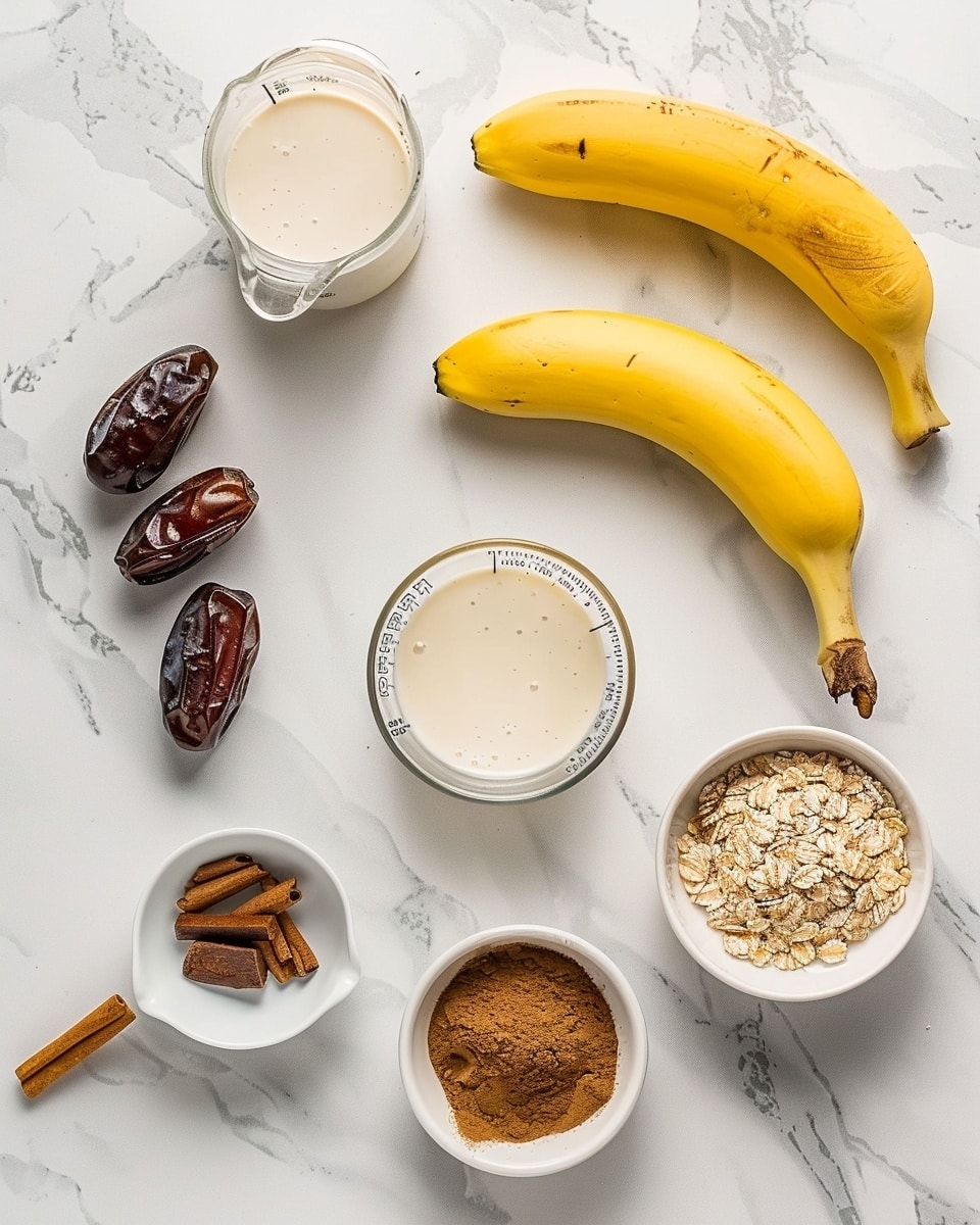 Single white glass filled with one creamy serving of a frothy date and banana smoothie, close-up angled shot revealing the thick, blended texture with tiny air bubbles, a transparent straw inserted, placed on a white marble surface beside two whole dates, frozen banana slices, and a small glass jar of smooth peanut butter, natural lighting highlighting the fresh, wholesome ingredients, intimate styled serving photo taken with an iphone --ar 4:5 --v 7