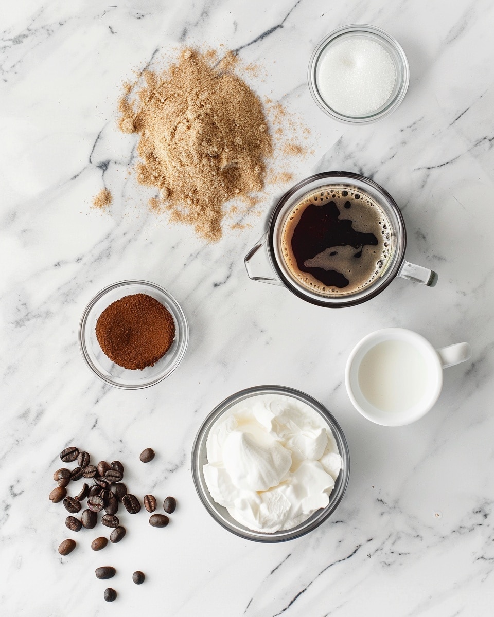Single tall clear glass on a white plate placed on white marble surface, filled with one serving of frozen coffee frappé showing swirling layers of creamy coffee and ice, topped with a generous swirl of whipped cream dusted with cinnamon, coffee beans scattered artistically around the plate, natural lighting highlighting the icy texture and creamy froth, intimate close-up angled view that captures the rich texture and inviting layers, styled as a food blog shot, photo taken with an iphone --ar 4:5 --v 7