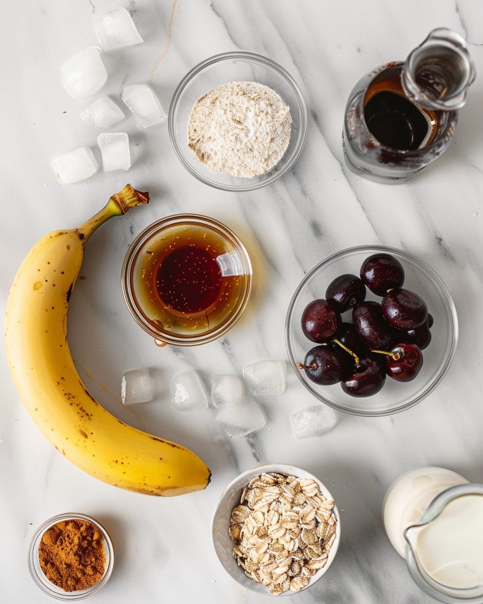 Single elegant white glass goblet filled with a thick, creamy cherry chocolate smoothie, close-up angled view showing the smooth texture and tiny bits of cherry throughout the drink, garnished with fresh dark red cherries scattered around on a white marble surface, natural lighting highlighting the rich color and inviting appeal, styled as a ready-to-drink individual serving from a food blog, photo taken with an iphone --ar 4:5 --v 7