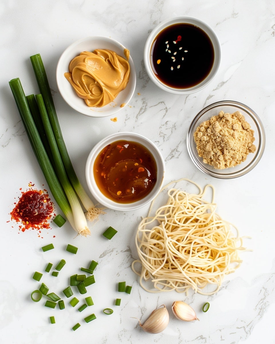 Single white bowl on a white marble surface filled with a close-up portion of spicy ramen noodles, showcasing the glossy, richly coated strands intertwined with finely chopped green onions and red chili flakes, steam gently rising from the warm textured noodles, natural lighting emphasizing the vibrant orange-red sauce clinging to the noodles, styled as a ready-to-eat single serving from a food blog, intimate angled shot photo taken with an iphone --ar 4:5 --v 7