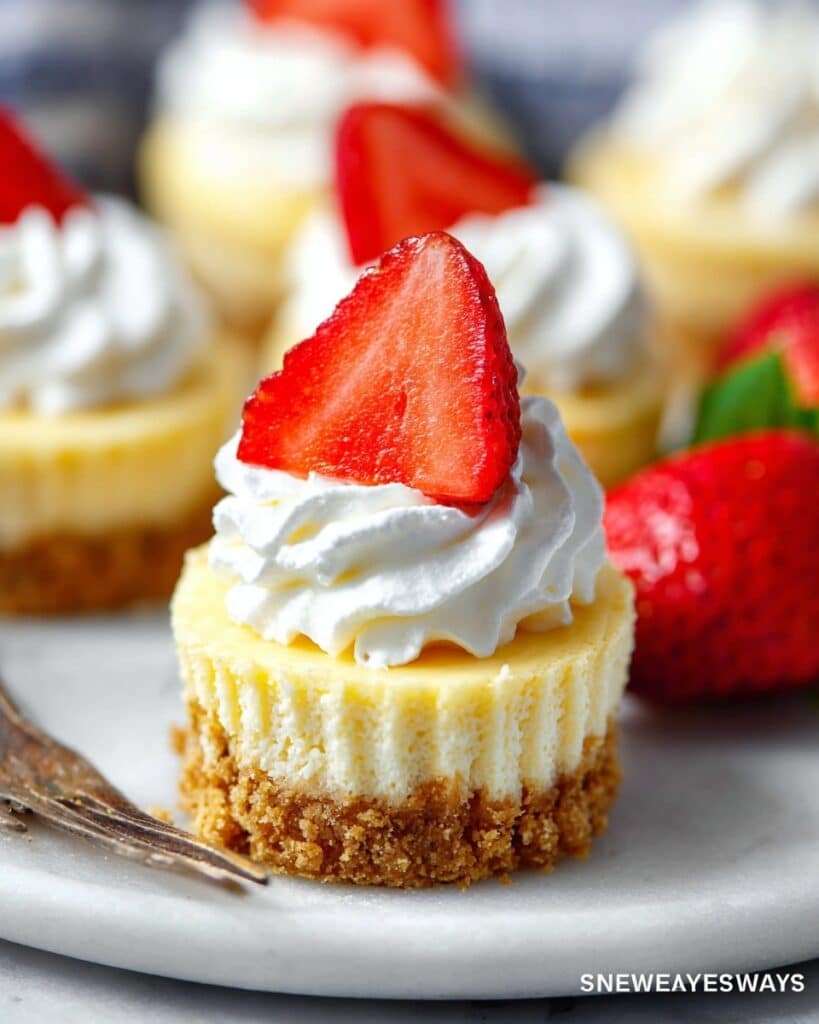 Mini Cheesecakes with Graham Cracker Crust and Fresh Berries Recipe