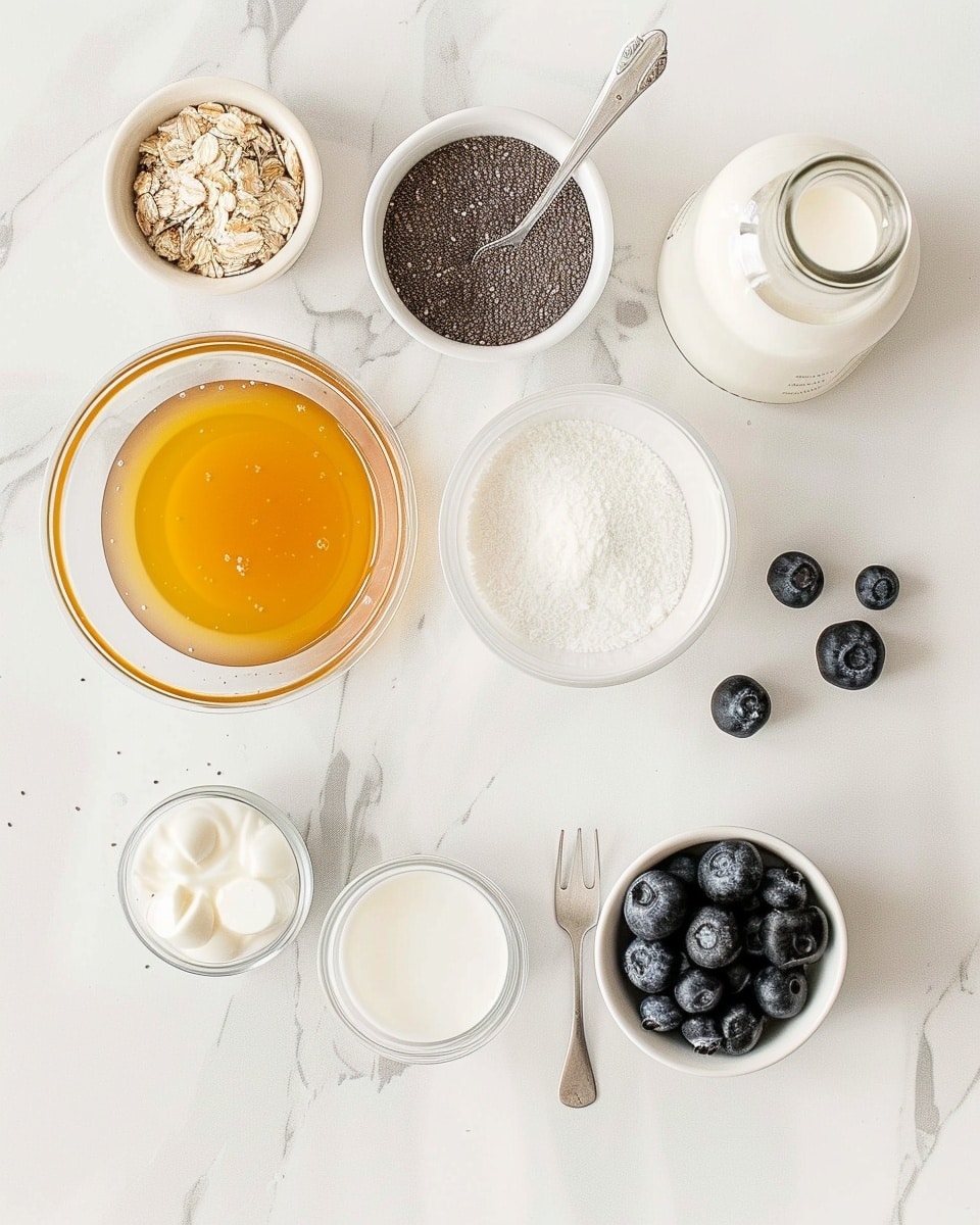 Single white bowl showing a close-up, intimate serving of creamy chia pudding layered over vibrant mixed berry compote, the chia seeds clearly visible with a gelatinous texture, topped with fresh blueberries and a glossy berry sauce finish, angled to reveal the distinct layers of pudding and compote within the bowl, placed on a white marble surface with natural lighting, styled like a food blog individual serving photo taken with an iphone --ar 4:5 --v 7