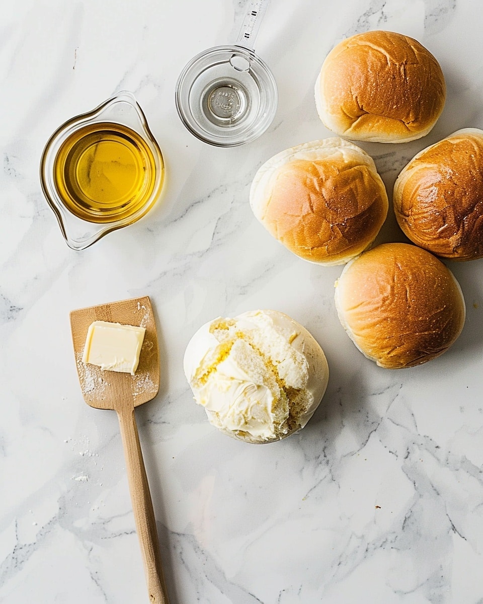 Single white plate with one golden, flaky spiral pastry dusted lightly with powdered sugar, angled to reveal the soft, layered interior texture, natural light emphasizing the buttery and airy layers, set on a white marble surface with a subtle blurred background, styled for a cozy food blog shot, photo taken with an iphone --ar 4:5 --v 7