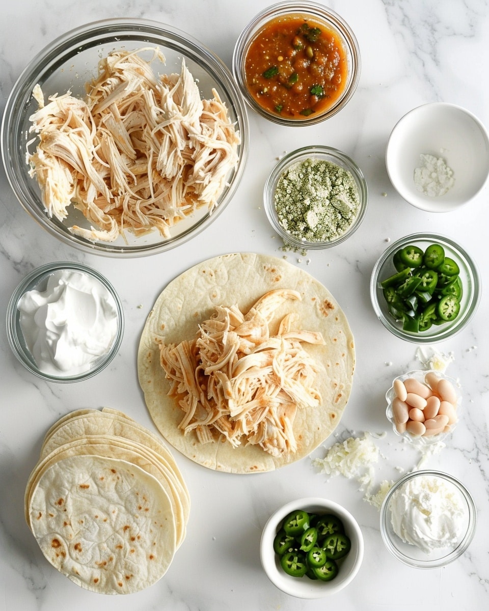 Single white plate with one plated portion of cheesy green chili chicken enchiladas, close-up angled view revealing the melted cheddar and mozzarella cheeses, tender shredded chicken and beans inside the enchilada layers, topped with fresh slices of jalapeño, diced avocado, tomato, and red onion, garnished with chopped cilantro, placed on a white marble surface with natural lighting, styled for an intimate food blog presentation, photo taken with an iphone --ar 4:5 --v 7